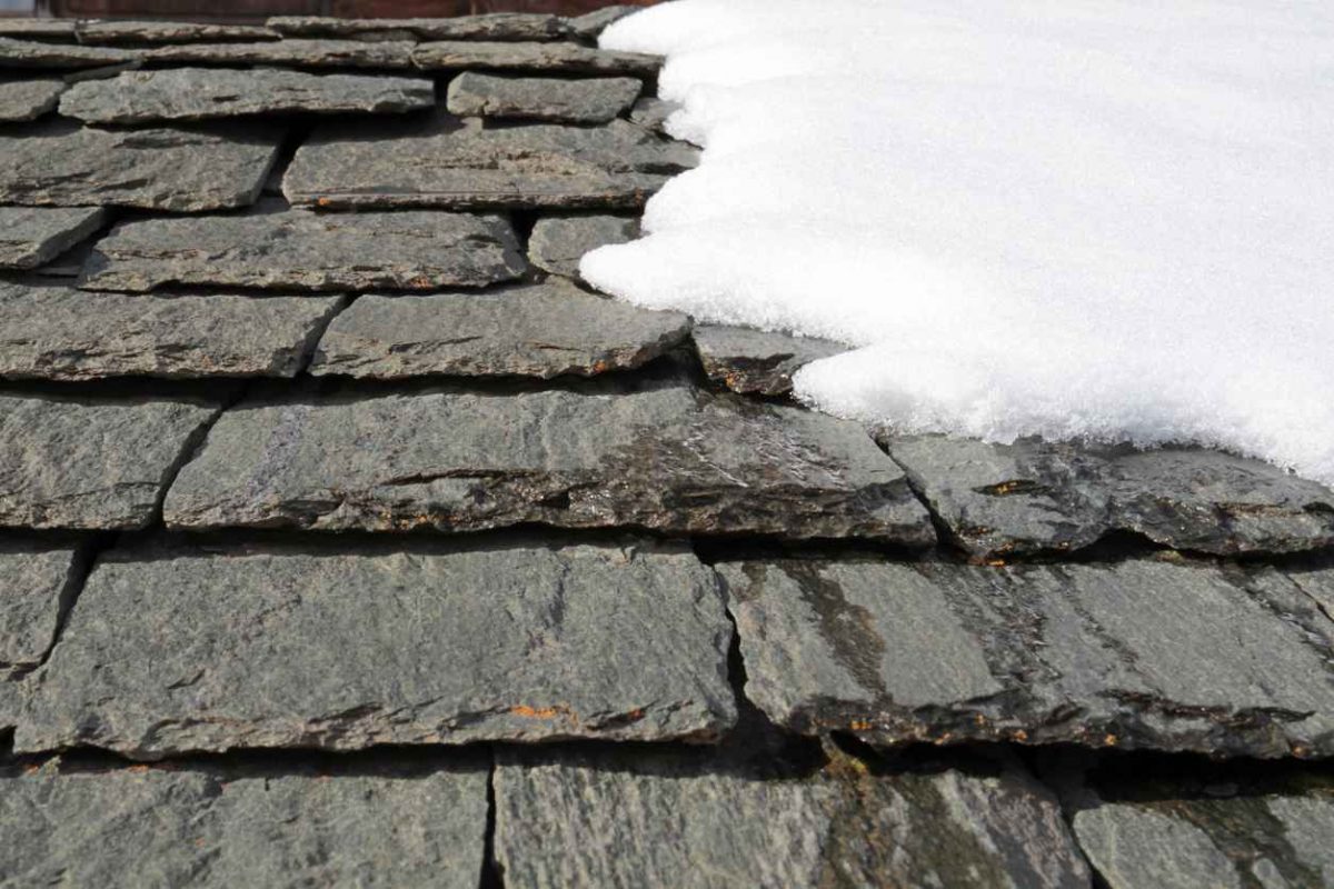 slate roof in winter with snow