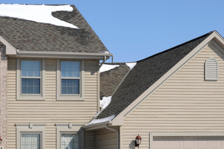 Architectural detail of house with emphasis on roof area. This is a good image to illustrate the need for a good roof in the winter. It also shows the vynal siding very nicely. Please also look at these images: