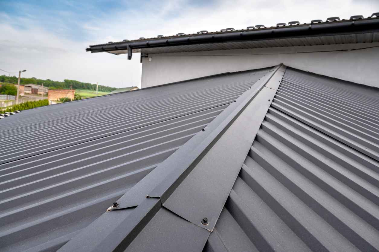 Gutter system for a metal roof. Holder gutter drainage system on the roof.