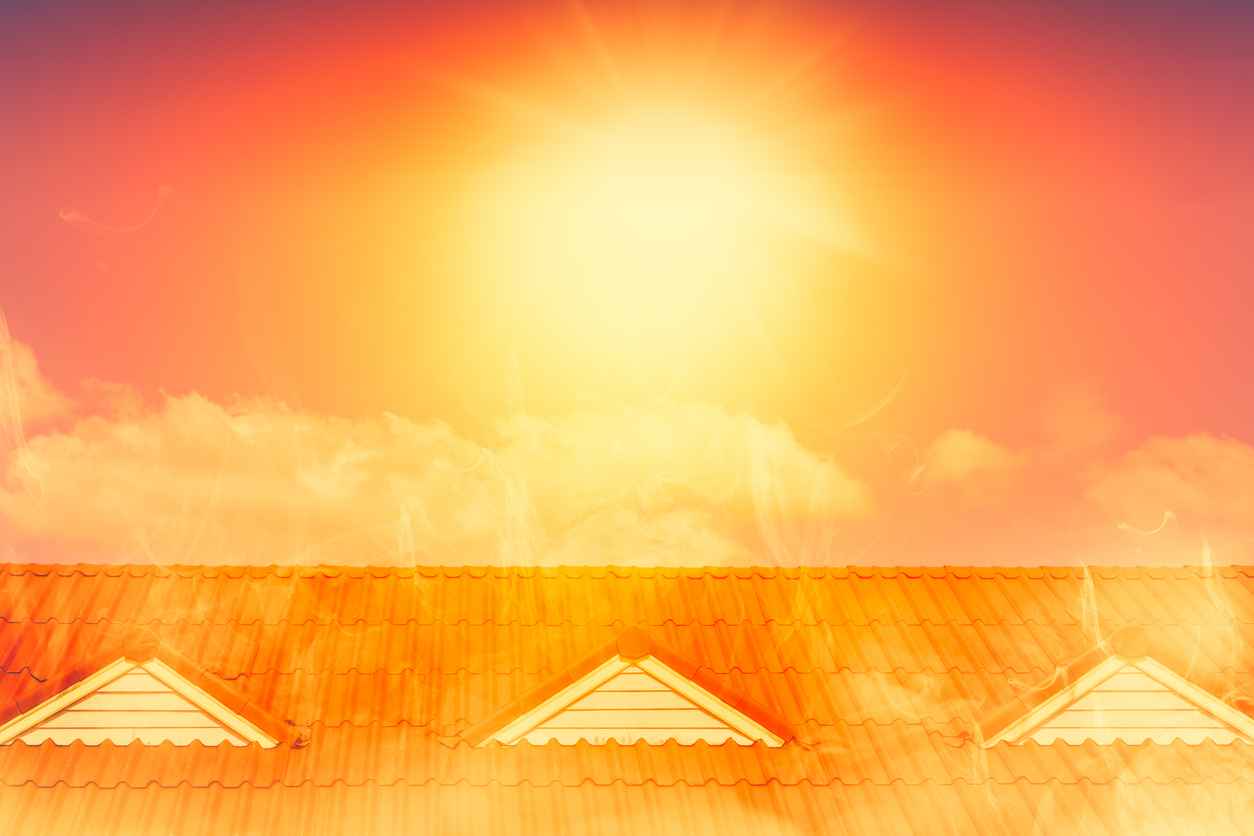 very hot weather, sun shining over a tile roof