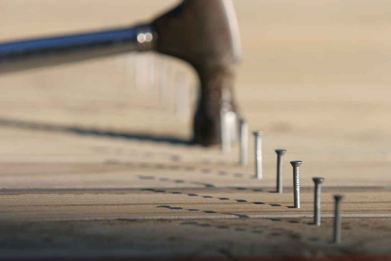 Line of nails and hammer